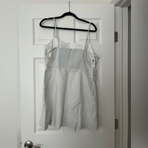 Never worn and too big. Color is called slate white.